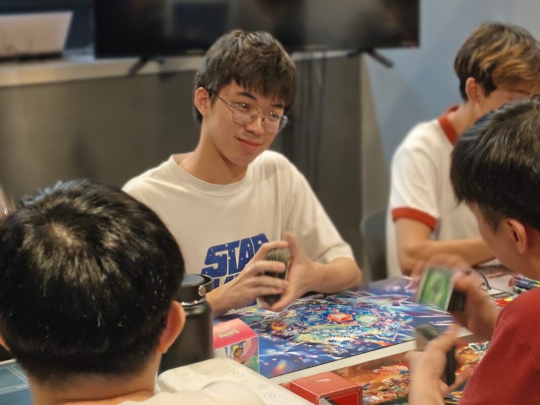Pokémon TCG player shuffling at an Atlas Gamers tournament