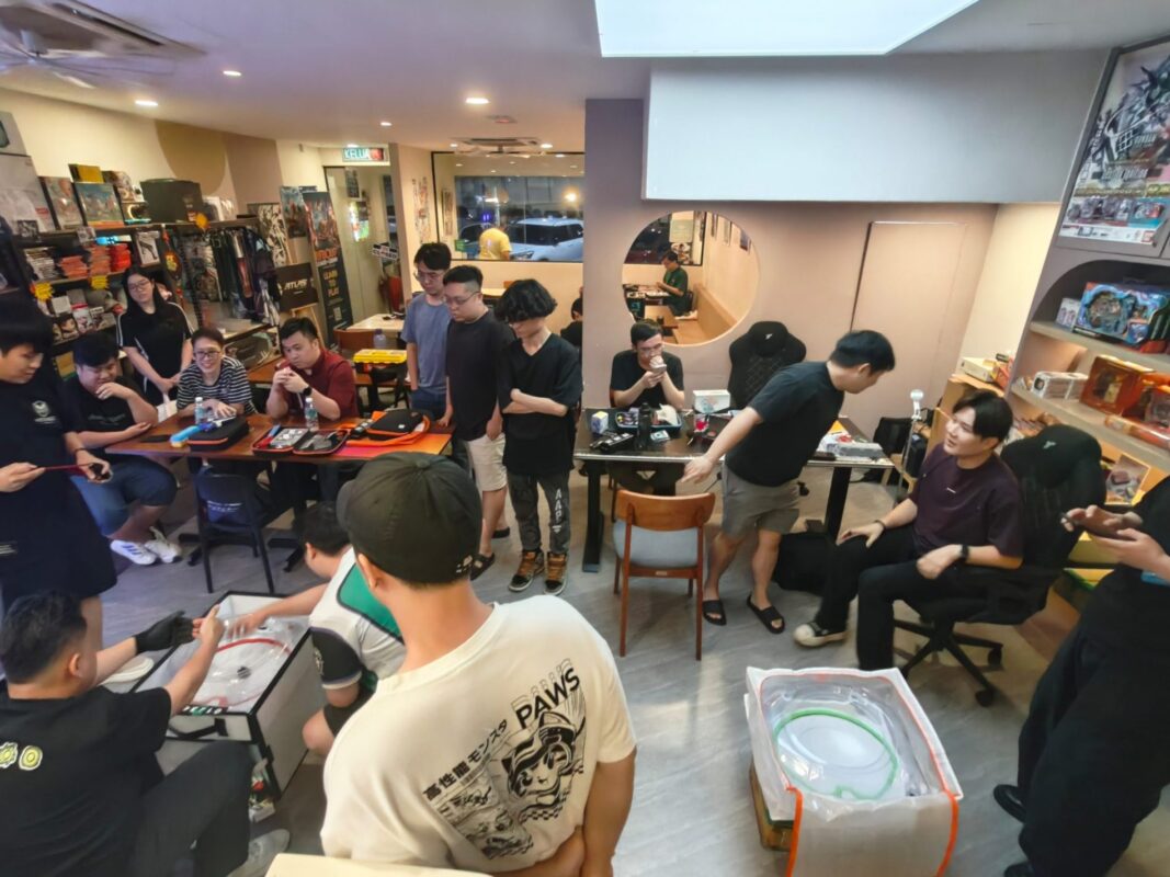 Atlas Gamers store floor with players and shelves